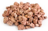 many light reddish blocks of Red Halloysite are piled together