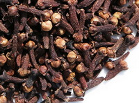 dried dark brown herbs of Flos Caryophylli are piled together
