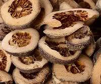 dried brownish herb slices of Immature Orange Fruit