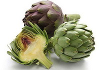 several fresh green and purple herbs of Cynara scolymus are placed together