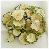 pale green dried bitter melon slices of Momordica charantia are piled together