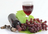 red grapes, a bottle and a cup of red wine