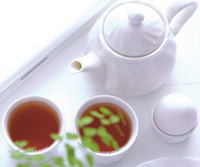 two cups of gymnema leaf tea and a teapot