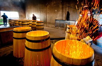 some workers are making American Oak Barrels