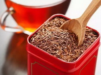 a box of red bush tea and a cup of red bush tea